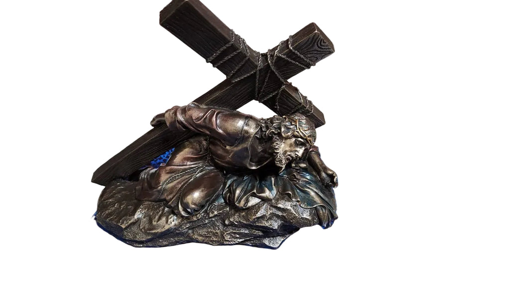 Jesus Christ Caring a cross in bronze color