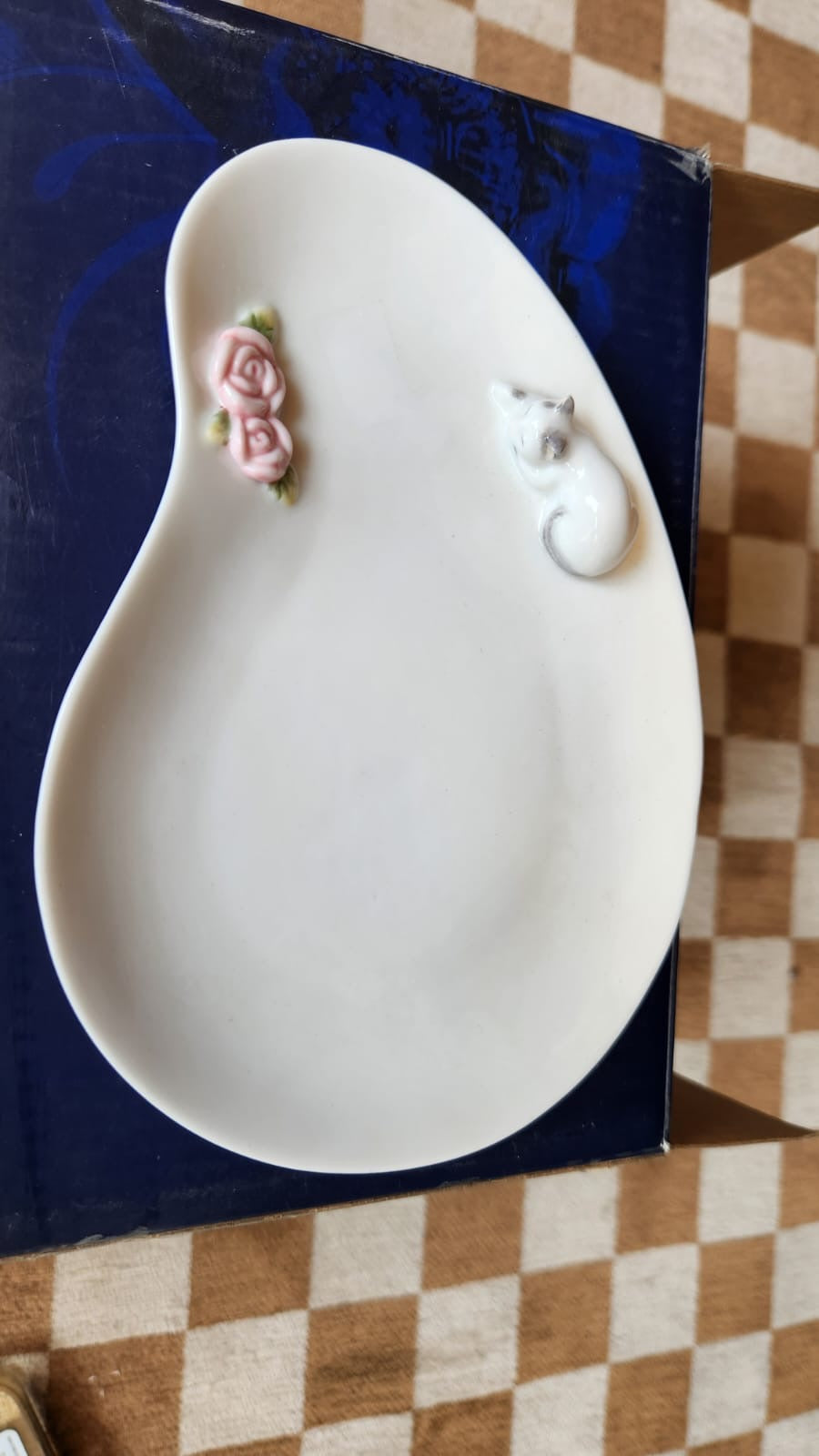 Cup and saucer with a nude lady in the cup