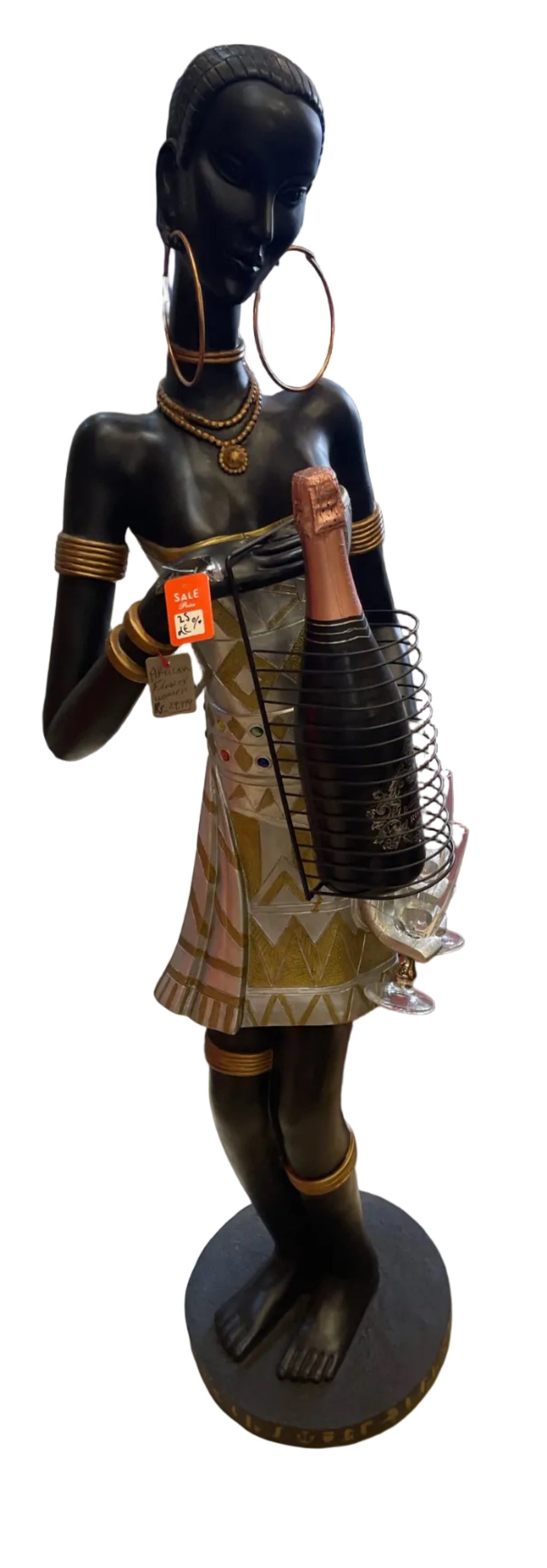 African woman holding a champagne bottle with glasses