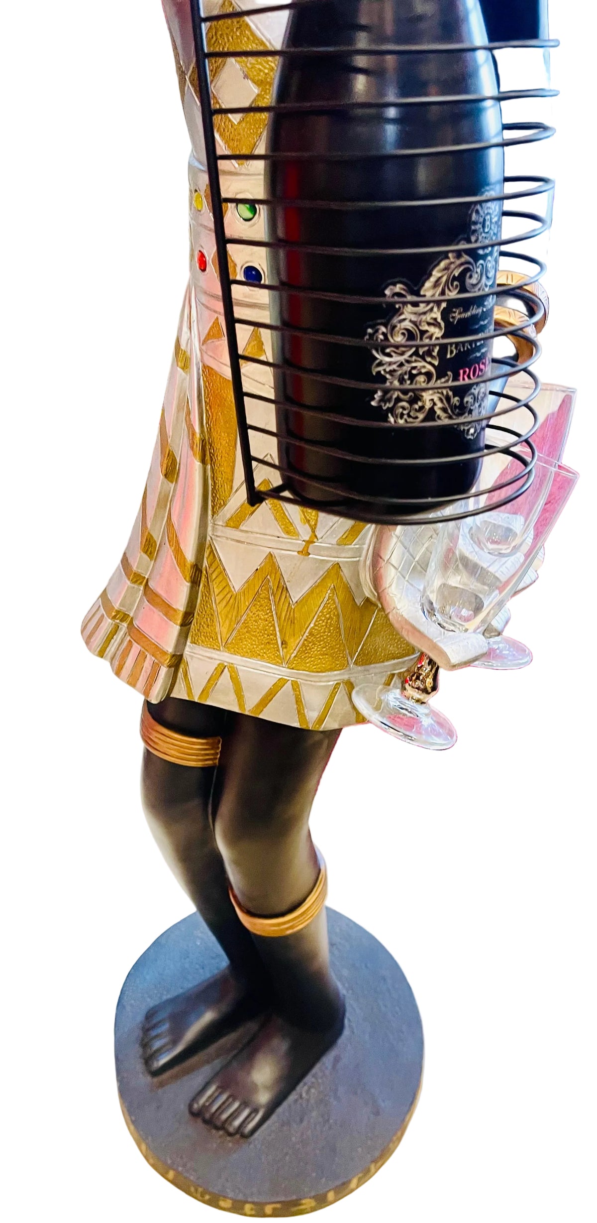 African woman holding a champagne bottle with glasses